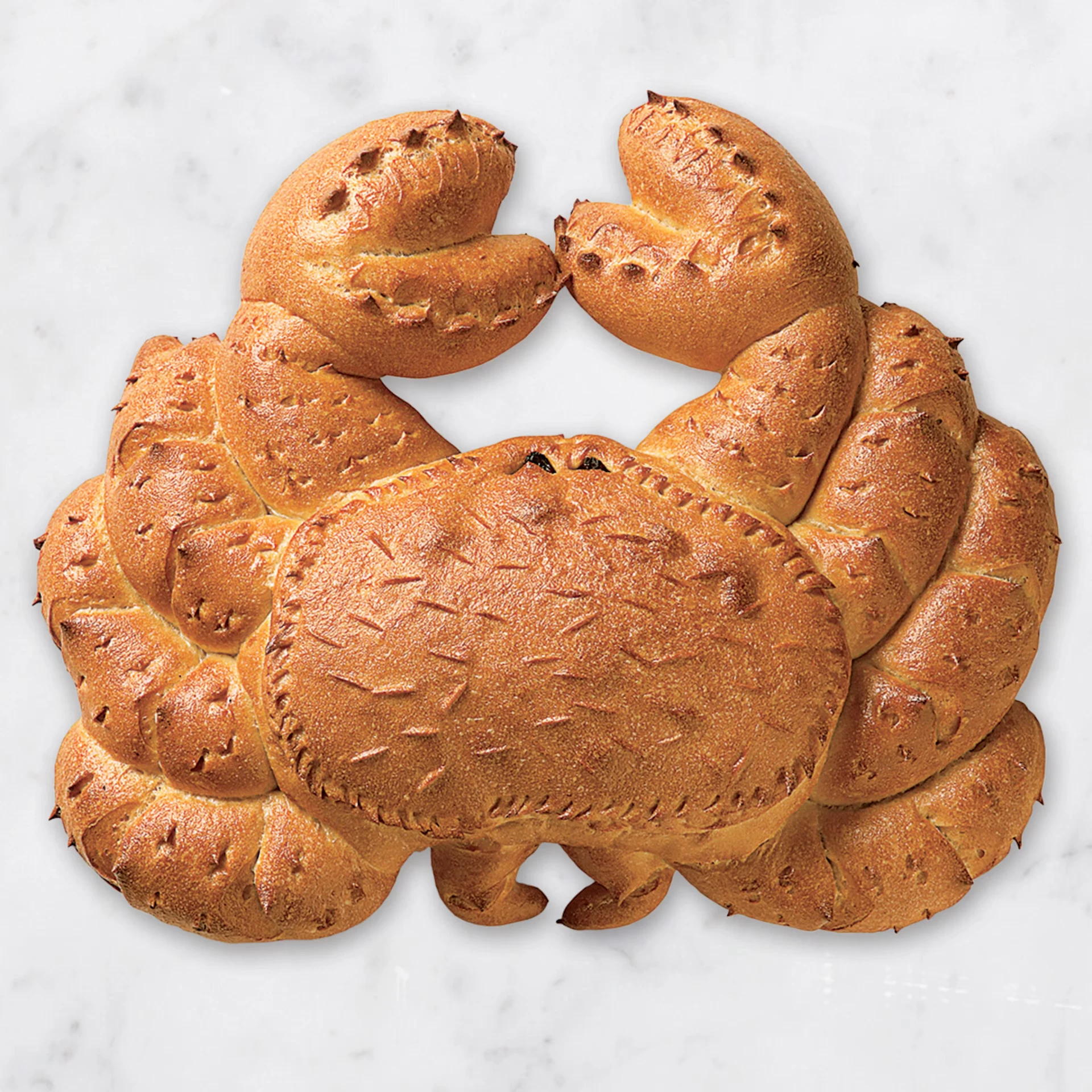 A sourdough loaf baked into the shape of a crab